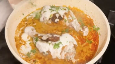 Creamy Iffa chicken coated in rich garlic cheese sauce and garnished with coriander